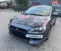 Сірий Міцубісі Lancer, об'ємом двигуна 2 л та пробігом 218 тис. км за 7400 $, фото 1 на Automoto.ua