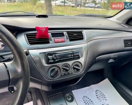 Сірий Міцубісі Lancer, об'ємом двигуна 1.58 л та пробігом 138 тис. км за 4990 $, фото 28 на Automoto.ua