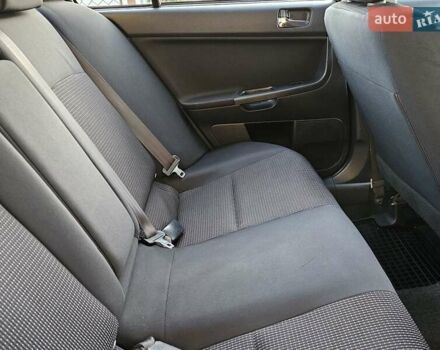 Серый Мицубиси Лансер, объемом двигателя 2 л и пробегом 282 тыс. км за 5450 $, фото 70 на Automoto.ua