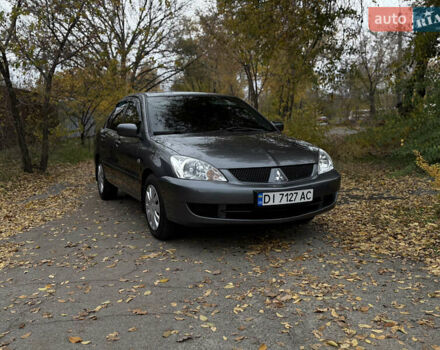 Сірий Міцубісі Lancer, об'ємом двигуна 1.58 л та пробігом 247 тис. км за 4900 $, фото 1 на Automoto.ua