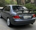 Серый Мицубиси Лансер, объемом двигателя 1.6 л и пробегом 250 тыс. км за 3999 $, фото 3 на Automoto.ua