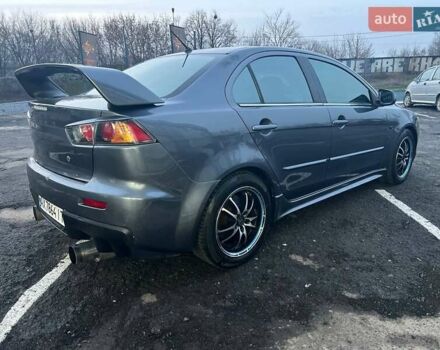 Серый Мицубиси Лансер, объемом двигателя 2 л и пробегом 170 тыс. км за 6999 $, фото 6 на Automoto.ua