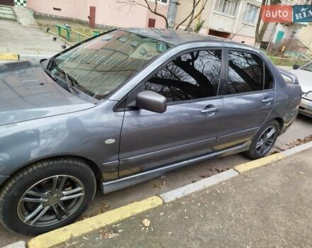 Сірий Міцубісі Lancer, об'ємом двигуна 1.58 л та пробігом 250 тис. км за 4750 $, фото 1 на Automoto.ua