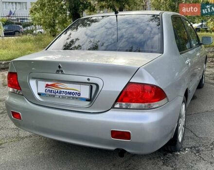 Сірий Міцубісі Lancer, об'ємом двигуна 1.58 л та пробігом 138 тис. км за 4990 $, фото 13 на Automoto.ua