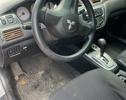 Сірий Міцубісі Lancer, об'ємом двигуна 1.58 л та пробігом 305 тис. км за 3300 $, фото 7 на Automoto.ua