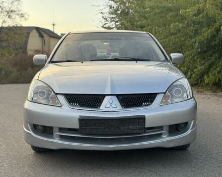Серый Мицубиси Лансер, объемом двигателя 2 л и пробегом 185 тыс. км за 4600 $, фото 3 на Automoto.ua