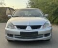 Серый Мицубиси Лансер, объемом двигателя 2 л и пробегом 185 тыс. км за 4600 $, фото 3 на Automoto.ua