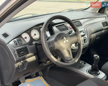 Серый Мицубиси Лансер, объемом двигателя 1.3 л и пробегом 160 тыс. км за 5555 $, фото 41 на Automoto.ua