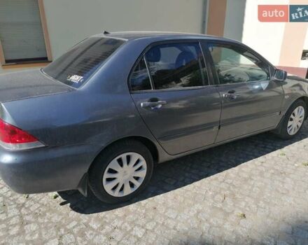 Серый Мицубиси Лансер, объемом двигателя 1.6 л и пробегом 205 тыс. км за 3800 $, фото 5 на Automoto.ua