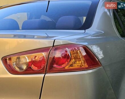 Серый Мицубиси Лансер, объемом двигателя 2 л и пробегом 282 тыс. км за 5450 $, фото 34 на Automoto.ua