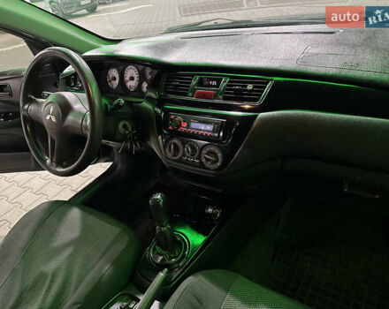 Серый Мицубиси Лансер, объемом двигателя 1.6 л и пробегом 112 тыс. км за 2800 $, фото 19 на Automoto.ua