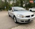 Серый Мицубиси Лансер, объемом двигателя 1.58 л и пробегом 250 тыс. км за 3999 $, фото 1 на Automoto.ua