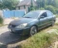 Сірий Міцубісі Lancer, об'ємом двигуна 1.6 л та пробігом 141 тис. км за 3503 $, фото 1 на Automoto.ua