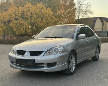Серый Мицубиси Лансер, объемом двигателя 2 л и пробегом 185 тыс. км за 4600 $, фото 2 на Automoto.ua
