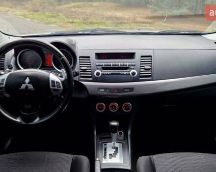 Серый Мицубиси Лансер, объемом двигателя 2 л и пробегом 213 тыс. км за 6550 $, фото 21 на Automoto.ua
