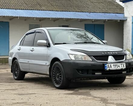 Серый Мицубиси Лансер, объемом двигателя 1.6 л и пробегом 298 тыс. км за 3600 $, фото 2 на Automoto.ua