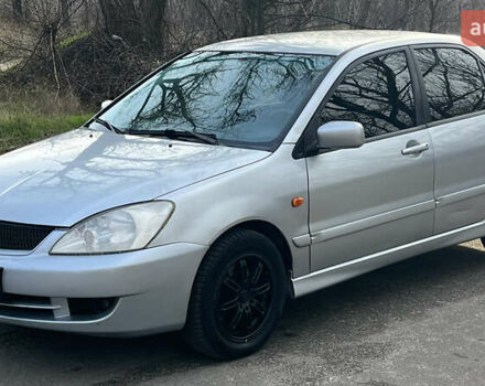 Серый Мицубиси Лансер, объемом двигателя 1.58 л и пробегом 290 тыс. км за 3750 $, фото 5 на Automoto.ua