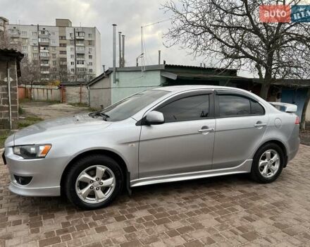 Серый Мицубиси Лансер, объемом двигателя 2 л и пробегом 180 тыс. км за 6799 $, фото 7 на Automoto.ua