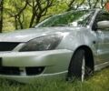 Серый Мицубиси Лансер, объемом двигателя 2 л и пробегом 150 тыс. км за 5600 $, фото 1 на Automoto.ua