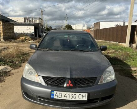 Серый Мицубиси Лансер, объемом двигателя 1.6 л и пробегом 200 тыс. км за 2300 $, фото 1 на Automoto.ua