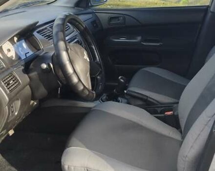 Серый Мицубиси Лансер, объемом двигателя 1.6 л и пробегом 205 тыс. км за 4500 $, фото 6 на Automoto.ua