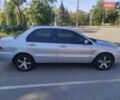 Серый Мицубиси Лансер, объемом двигателя 1.6 л и пробегом 187 тыс. км за 4500 $, фото 1 на Automoto.ua