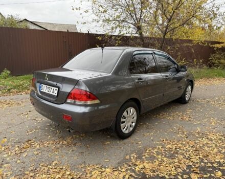 Сірий Міцубісі Lancer, об'ємом двигуна 1.6 л та пробігом 247 тис. км за 4900 $, фото 2 на Automoto.ua