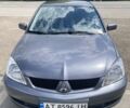 Сірий Міцубісі Lancer, об'ємом двигуна 1.59 л та пробігом 44 тис. км за 6200 $, фото 7 на Automoto.ua