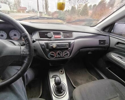 Серый Мицубиси Лансер, объемом двигателя 1.6 л и пробегом 238 тыс. км за 2900 $, фото 7 на Automoto.ua