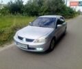 Серый Мицубиси Лансер, объемом двигателя 1.58 л и пробегом 200 тыс. км за 2300 $, фото 3 на Automoto.ua