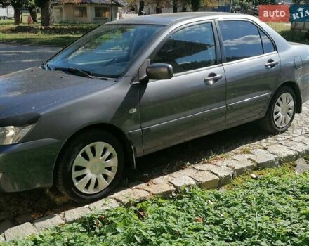 Серый Мицубиси Лансер, объемом двигателя 1.6 л и пробегом 205 тыс. км за 3800 $, фото 4 на Automoto.ua