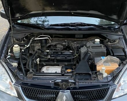 Серый Мицубиси Лансер, объемом двигателя 1.6 л и пробегом 250 тыс. км за 3999 $, фото 10 на Automoto.ua