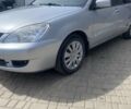 Серый Мицубиси Лансер, объемом двигателя 1.6 л и пробегом 238 тыс. км за 5000 $, фото 1 на Automoto.ua
