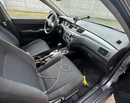 Серый Мицубиси Лансер, объемом двигателя 1.6 л и пробегом 129 тыс. км за 5000 $, фото 5 на Automoto.ua