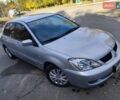 Сірий Міцубісі Lancer, об'ємом двигуна 1.58 л та пробігом 122 тис. км за 6300 $, фото 22 на Automoto.ua