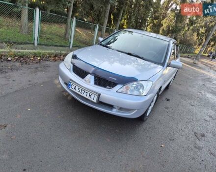 Сірий Міцубісі Lancer, об'ємом двигуна 1.58 л та пробігом 235 тис. км за 5200 $, фото 1 на Automoto.ua