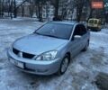 Серый Мицубиси Лансер, объемом двигателя 1.58 л и пробегом 231 тыс. км за 3600 $, фото 1 на Automoto.ua