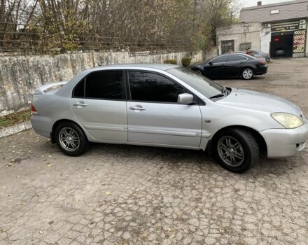 Серый Мицубиси Лансер, объемом двигателя 1.6 л и пробегом 380 тыс. км за 4000 $, фото 3 на Automoto.ua