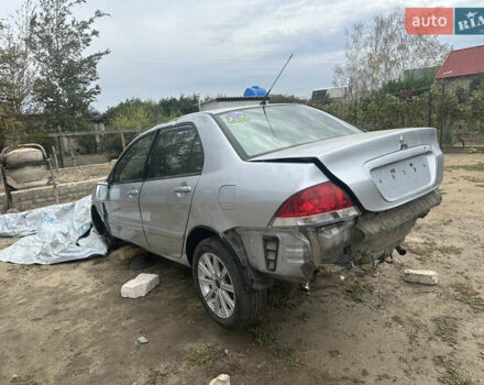 Сірий Міцубісі Lancer, об'ємом двигуна 1.58 л та пробігом 210 тис. км за 1300 $, фото 3 на Automoto.ua