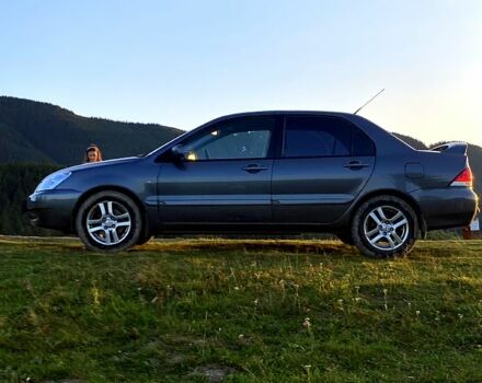 Сірий Міцубісі Lancer, об'ємом двигуна 1.6 л та пробігом 240 тис. км за 4450 $, фото 4 на Automoto.ua