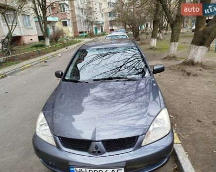 Сірий Міцубісі Lancer, об'ємом двигуна 1.58 л та пробігом 250 тис. км за 4750 $, фото 7 на Automoto.ua