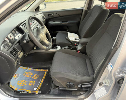 Серый Мицубиси Лансер, объемом двигателя 1.3 л и пробегом 160 тыс. км за 5555 $, фото 38 на Automoto.ua