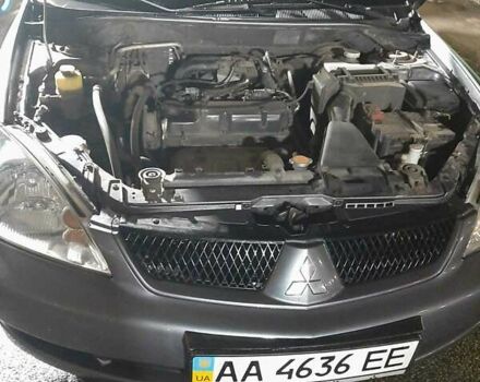 Серый Мицубиси Лансер, объемом двигателя 1.6 л и пробегом 238 тыс. км за 3799 $, фото 1 на Automoto.ua