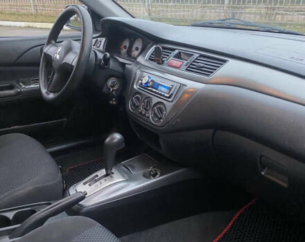 Серый Мицубиси Лансер, объемом двигателя 1.6 л и пробегом 346 тыс. км за 4299 $, фото 11 на Automoto.ua