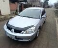 Сірий Міцубісі Lancer, об'ємом двигуна 1.8 л та пробігом 107 тис. км за 4300 $, фото 1 на Automoto.ua
