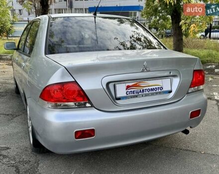 Сірий Міцубісі Lancer, об'ємом двигуна 1.58 л та пробігом 138 тис. км за 4990 $, фото 10 на Automoto.ua