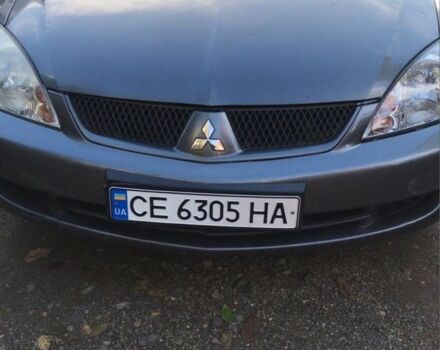 Серый Мицубиси Лансер, объемом двигателя 1.5 л и пробегом 269 тыс. км за 4200 $, фото 7 на Automoto.ua