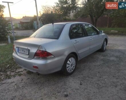 Серый Мицубиси Лансер, объемом двигателя 1.6 л и пробегом 223 тыс. км за 3300 $, фото 1 на Automoto.ua