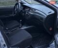 Серый Мицубиси Лансер, объемом двигателя 1.6 л и пробегом 210 тыс. км за 4600 $, фото 7 на Automoto.ua