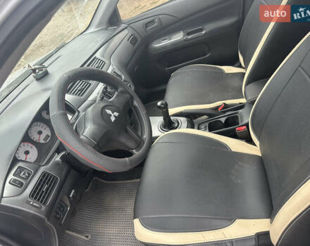 Сірий Міцубісі Lancer, об'ємом двигуна 1.58 л та пробігом 210 тис. км за 1300 $, фото 2 на Automoto.ua